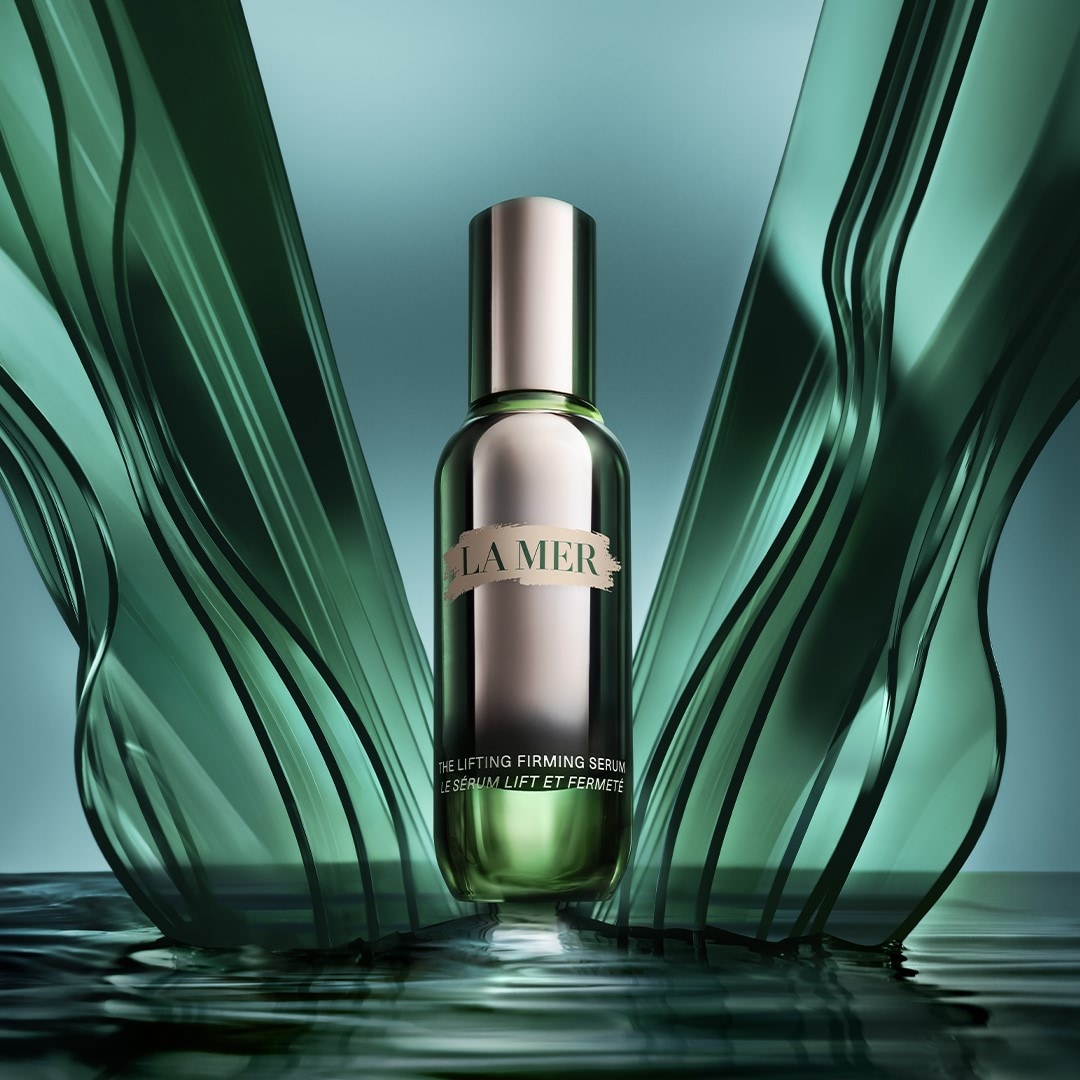 Lifting firming serum bottle in the middle of glass vertical waves.